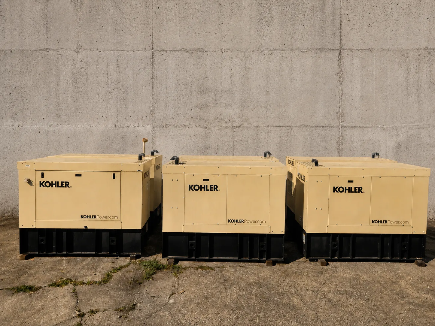 Several Kohler 15REOZK standby generator units staged on pallets